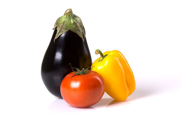 Fresh eggplant, tomato, paprika isolated on a white background.
