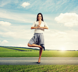 Fototapeta na wymiar attractive smiley woman in yoga pose