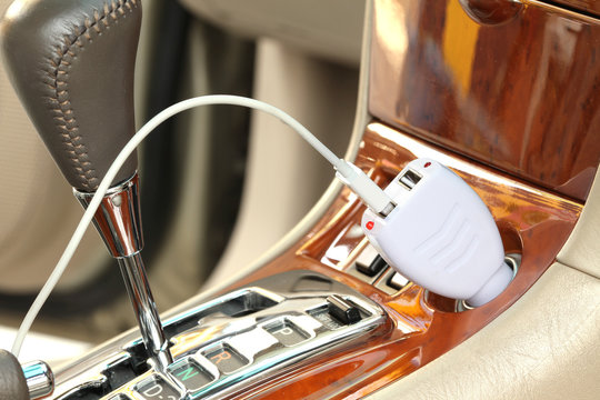 USB Adapter Converter Plug With Charging Cable On A Car