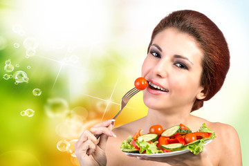 Young Beautiful Girl eating Fresh Vegetables Salad.Vegetarian