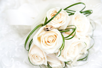 Wedding rings and bouquet