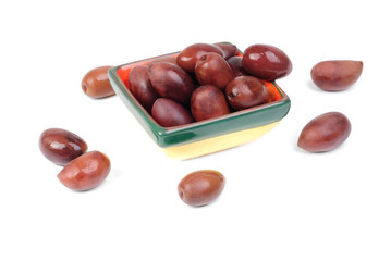Kalamata olives in bowl isolated on white background