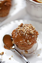 Fototapeta na wymiar Muffin with caramel frosting and nuts