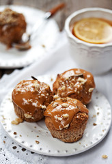 Fototapeta na wymiar Muffins with caramel frosting and nuts
