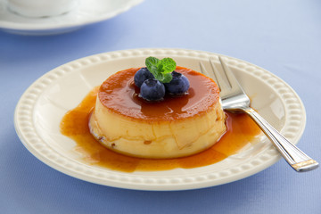 Creme caramel with fresh blueberries.