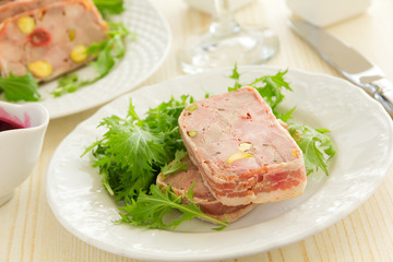 Duck terrine with pistachios and cherries.