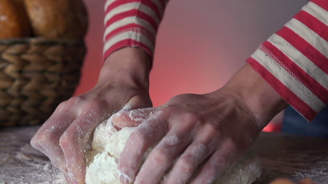 Woman kneading dough on the table, super slow motion 240fps