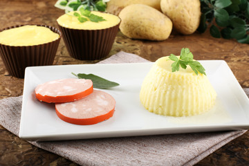 Fresh mashed potatoes, stuffed with sausage and cheese.