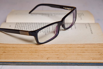 Reading glass on an old book