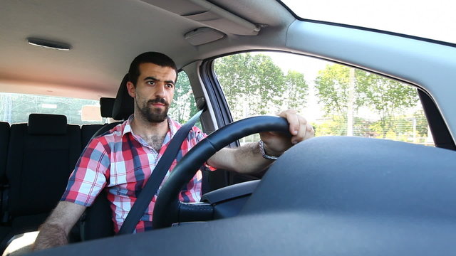 Young Man Driving a Car