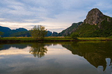 Fototapeta na wymiar Mountain lake reflection in Prajuabkirikhan Province of Thailand