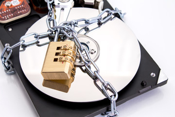Hard drive disk and padlock. Data security concept.