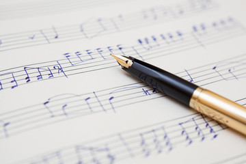  pen and music sheet with handwritten notes