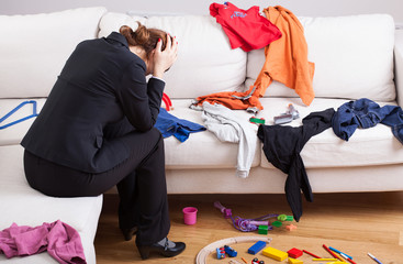 Unhappy woman in mess