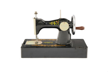 Small old black sewing machine isolated object
