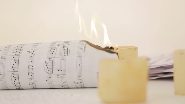 Note sheet on fire. Close-up