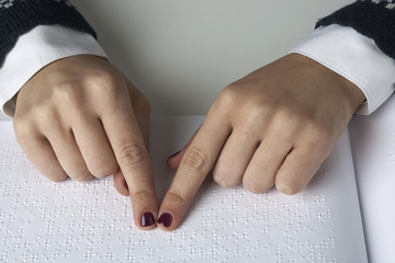 Blind reading text in braille language