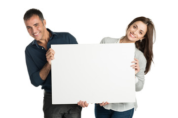 Satisfied Couple Holding A Placard