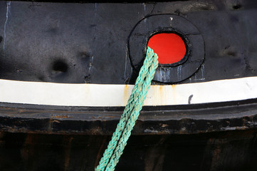 tug ship docked with rope