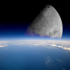 Naklejka premium Księżyc unosi się nad Ziemią.