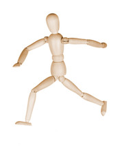 Wooden dummy in a pose of the running person