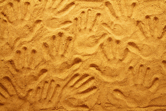 hand prints in the sand