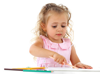 Beautiful smiling girl draws pencil