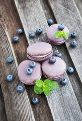 Violet french macarons with blueberry and mint