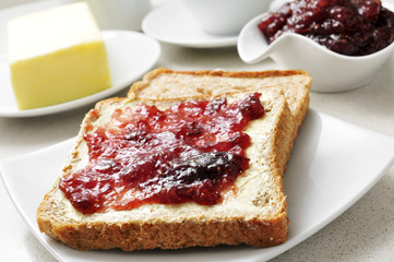 coffee and toasts with butter and jam