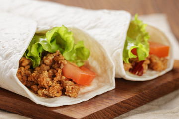 burritos with beef tomato and salad leaf