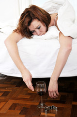 red hair woman with hangover after drinking wine
