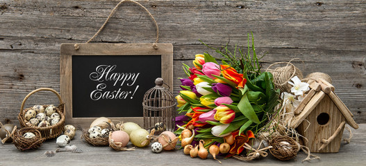 easter decoration with eggs and tulip flowers - obrazy, fototapety, plakaty