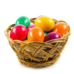 easter eggs in busket on green gras isolated