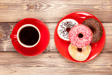 Tasty donut with a cup of coffee