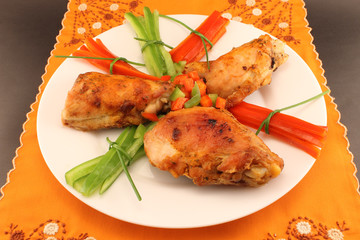 Grilled chicken on a plate on the table