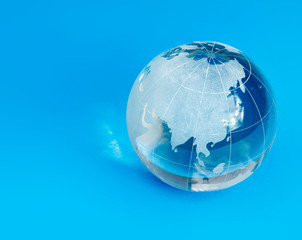 glass globe , isolated on blue background
