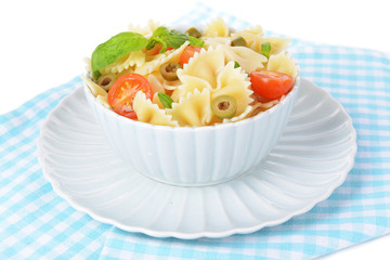Delicious pasta with tomatoes on plate on table close-up