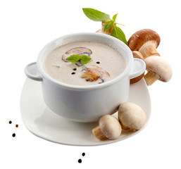 Mushroom soup in white bowl, on plate, isolated on white