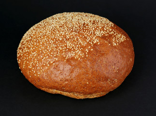 Loaf of bread on black background