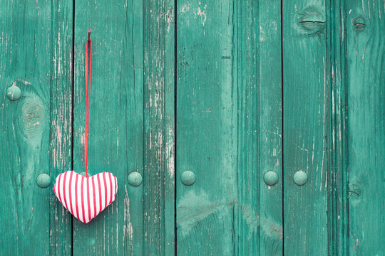 Valentine heart on vintage wooden wall background