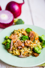 Brown rice with vegetables(onions,mushrooms,broccoli) and tofu