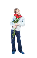 Beautiful romantic boy holding a bouquet of red flowers