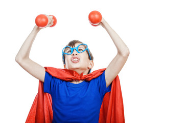 Beautiful funny child superman training with small dubbells