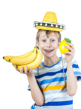 Beautiful child in stylish t-shirt holds bananas and lemon