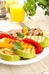 Delicious grilled vegetables on plate on table close-up