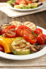 Delicious grilled vegetables on plate on table close-up