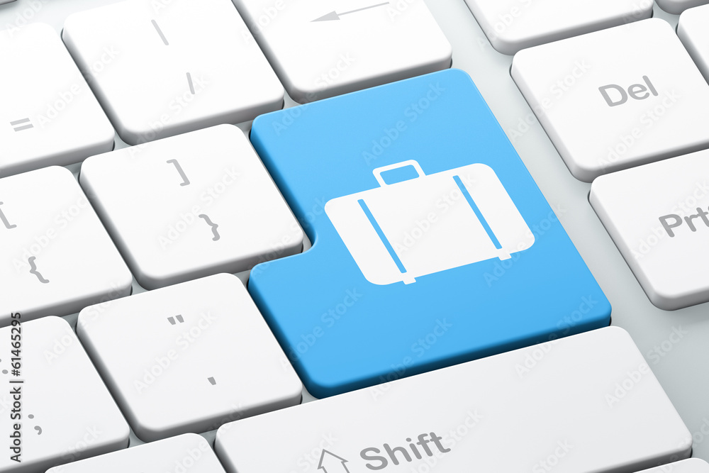 Poster travel concept: bag on computer keyboard background