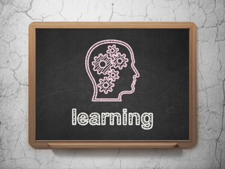 Education concept: Head With Gears and Learning on chalkboard