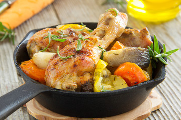 Fried chicken legs with vegetables.