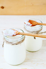 fresh homemade yogurt, sour cream in jars